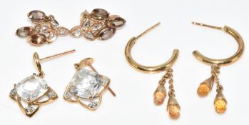 Three pairs of 9ct gold earrings comprising yellow sapphire and diamond, andalusite and diamond