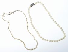 A single strand of cultured pearls with Victorian clasp set with plaited hair surrounded by split