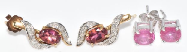A pair of 9k white gold earrings set with an oval cut ruby and a pair of 9k gold earrings set with