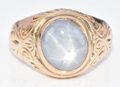 A c1910 9ct gold ring set with a star sapphire cabochon, 16.7g, size R