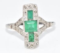 Art Deco platinum ring set with three rectangular cut emeralds, the largest approximately 0.4ct, and