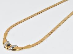 An 18ct gold necklace set with an oval cut sapphire and diamonds, 24.5g, 47cm