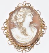 Victorian 9ct gold brooch set with a cameo depicting a young woman, 15.6g, 6 x 5cm