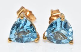 A pair of 9k gold earrings set with blue topaz, 1g