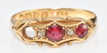 An 18ct gold ring set with spinel and diamonds, 2.1g, size K/L