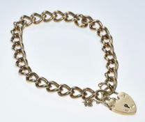 A 9ct gold curb link bracelet with heart padlock clasp, 29.3g, 19cm