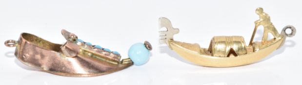 A 14k gold charm in the form of a gondola (1.1g) and a yellow metal charm in the form of a shoe (1.