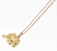 A yellow metal elephant charm/ pendant (tests as 18k gold, 4g) and 9ct gold chain (2.7g, 56cm)