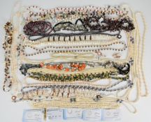 Twenty six pearl necklaces and two pearl bracelets