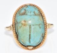 An 18ct gold ring set with a scarab beetle, 4.8g, size M