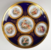 19th/20thC continental porcelain charger, probably Vienna, with named cherub and putti