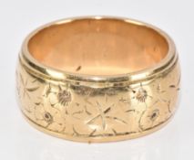 A 9ct gold wedding band / ring with engraved decoration, 12.1g, size T
