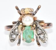 A 9ct gold ring in the form of a fly set with an oval cut emerald, pearl and rose cut diamonds, 3.