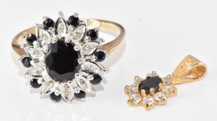 A 9ct gold ring set with an oval cut sapphire surrounded by further round cut sapphires and