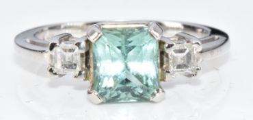 A 14k white gold ring set with an emerald mixed cut Paraiba tourmaline of approximately 1.7ct and
