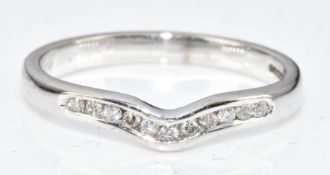 A 9ct white gold ring/ wedding band set with a diamonds, 1.9g, size K