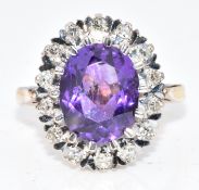 An 18ct gold ring set with an oval cut amethyst surrounded by diamonds, 4.8g, size H/I