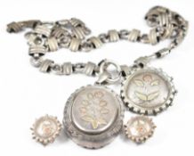 Victorian silver locket with embossed gold floral decoration, on Victorian collar / necklace, with