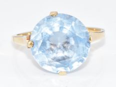 A 15ct gold ring set with a round cut synthetic spinel, 3.4g, size N