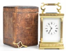 Late 19th or early 20th century carriage clock with gilt or polished brass case having reeded column