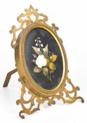 19th or early 20th century gilt fretwork photograph frame with easel back, set with a floral