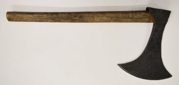 An executioner's axe with later handle, the head 32 x 25cm, the handle 68cm. PLEASE NOTE: WE ARE NOT