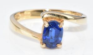 A 9ct gold ring set with an oval cut spinel, 2.6g, size N