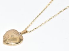 A 9ct gold heart shaped locket set with a diamond on 9ct gold chain, 3.8g, 44cm
