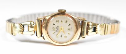 MuDu 18ct gold ladies wristwatch with gold hands, hour markers and Arabic numerals, silver dial
