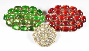 Two brooches set with foiled cabochons and a Victorian brooch set with foiled paste