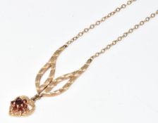 A 9ct gold necklace set with a cluster of garnets, 4.3g, 40cm