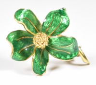 An 18k gold brooch in the form of a flower set with green enamel, 3.5cm, 8.4g