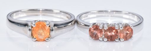 Two 9k white gold rings, one set with a oval cut garnet and the other three andesine, 5.2g, size N
