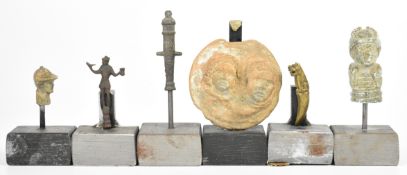Six mounted artefacts including a bust of jockey Fred Archer, table cannon, brass dog of Fo, pottery