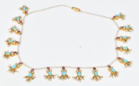 Indian single strand of seed pearls with seventeen gold pendants set with turquoise, split pearls,