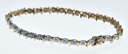A 9ct gold bracelet set with diamonds in illusion settings, 6.4g, 18cm