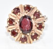 A 9ct gold ring set with garnets, 4.3g, size O