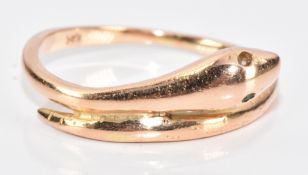 A 14k rose gold ring in the form of a serpent set with one emerald eye (the other emerald