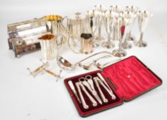 Silver plated items to include Elkington Victorian three piece teaset, cased nut set, covered desk