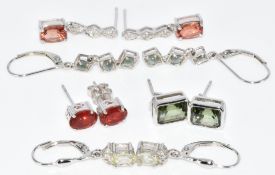 Five pairs of 9k white gold earrings comprising green tourmaline, cat's eye Alexandrite, fire