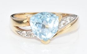A 9ct gold ring set with a trillion cut topaz and cubic zirconia, 3.1g, size N