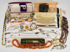 A collection of jewellery including Tissot watch, earrings, beaded coral necklace, silver medallion,