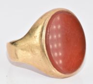A 9ct gold signet ring set with carnelian agate, 7.8g, size R