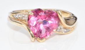 A 9ct gold ring set with a heart cut pink topaz, 4.2g, size M
