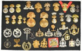 Approximately 40 cap badges and insignia, some Special Forces units including Popski's Private