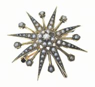 Edwardian15ct gold brooch / pendant in the form of a star set with split pearls (one missing), in