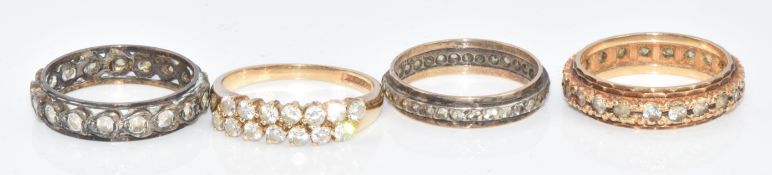 Three 9ct gold rings, comprising one set with cubic zirconia and two eternity rings set with