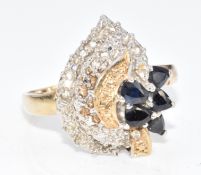 A 9ct gold bi-coloured ring set with pear cut sapphires and diamonds, 4.3g, size Q