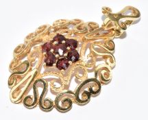 A 14k gold pendant set with a cluster of garnets, 6.1g, 4.1 x 2.2cm