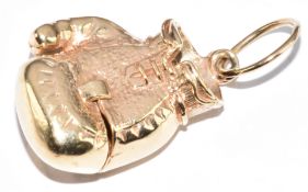 A 9ct gold boxing glove charm opening to reveal men boxing, 9.6g, 2.4cm